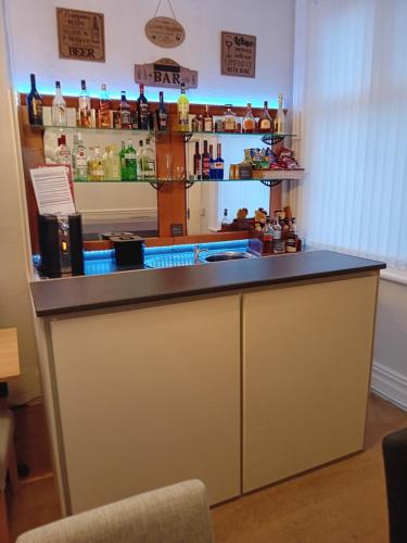 a bar in a room with a counter at Nathans in Blackpool
