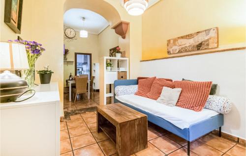 a living room with a blue couch and a table at 2 Bedroom Lovely Apartment In Cordoba in Córdoba