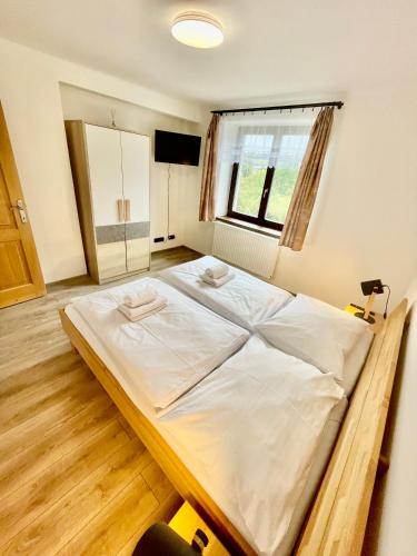 Postel nebo postele na pokoji v ubytování Apartmány U rybníků