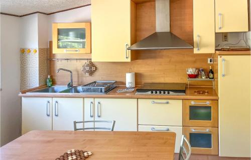 a kitchen with a sink and a stove at Stunning Apartment In Penne With Wifi in Penne