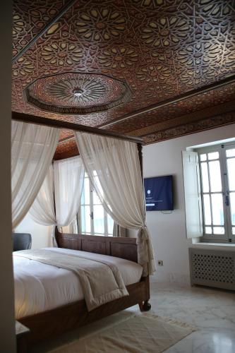 Postel nebo postele na pokoji v ubytování La Menara Hotel & SPA