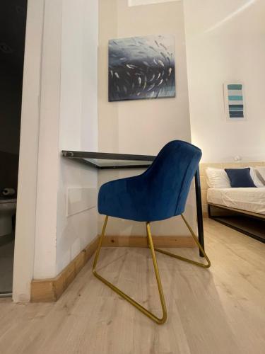 Ένα ή περισσότερα κρεβάτια σε δωμάτιο στο D'Angiò Rooms-Manfredi Homes&Villas