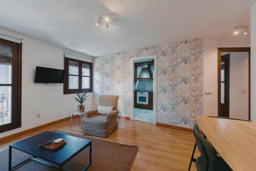 Μια τηλεόραση ή/και κέντρο ψυχαγωγίας στο Apartamentos exclusivos en casco histórico