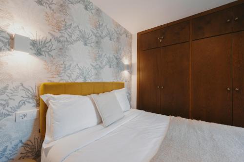 Ένα ή περισσότερα κρεβάτια σε δωμάτιο στο Apartamentos exclusivos en casco histórico