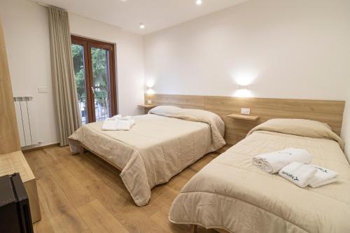 Postel nebo postele na pokoji v ubytování B&B Loricaly