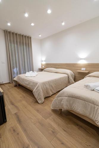 Una cama o camas en una habitación de B&B Loricaly