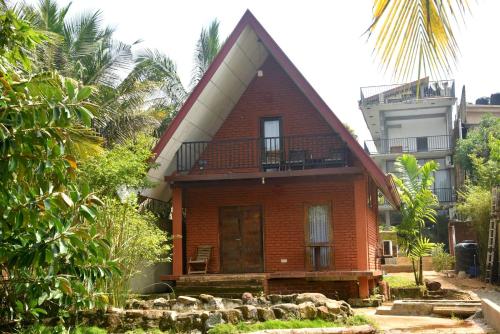 a brick house with a balcony on top of it at Ciel Star Anuradhapura in Anuradhapura