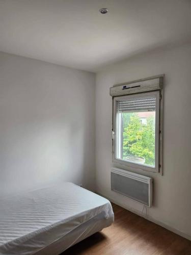 Ένα ή περισσότερα κρεβάτια σε δωμάτιο στο Paris Appartement Near 12Univ