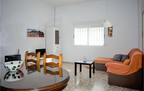 a living room with a couch and a table at Lovely Home In Xativa-Almaseretes in Caserío Casa Sanchis