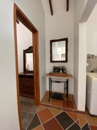 a bathroom with a sink and a mirror at Casa campo Ana in Piedecuesta
