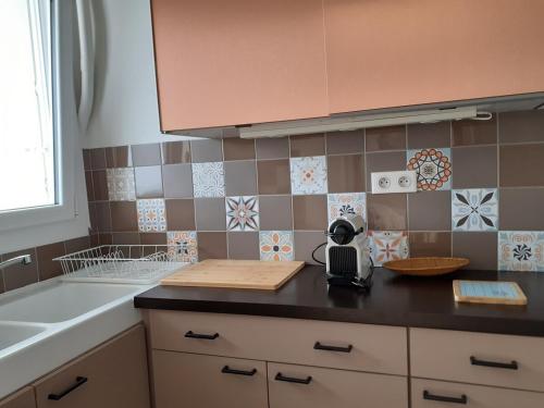 Η κουζίνα ή μικρή κουζίνα στο Appartement face mer Rêve de Flo ts