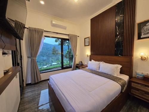 Giường trong phòng chung tại Villa Garden Grove