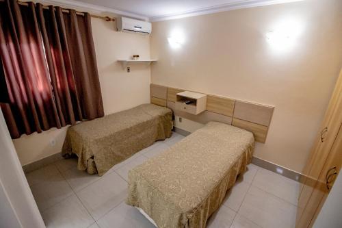 Postel nebo postele na pokoji v ubytování Internacional Resort