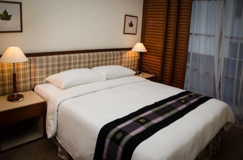 Posteľ alebo postele v izbe v ubytovaní The Maple Suite
