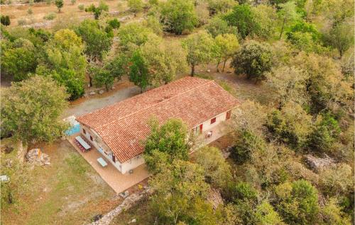 an overhead view of a house with a roof at Beautiful Home In Courry With Kitchen in Courry