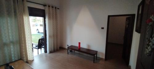 a living room with a bench and a window at Sella Villa in Seeduwa