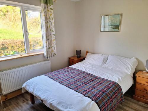 Postel nebo postele na pokoji v ubytování Lough Lea House, Bunnamuca