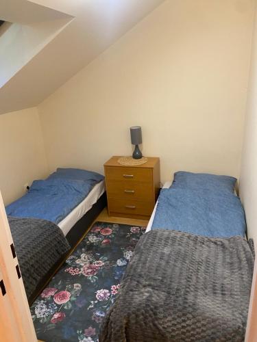 Posteľ alebo postele v izbe v ubytovaní Apartament u Piotra