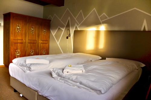 Postel nebo postele na pokoji v ubytování Hotel Garni Edy