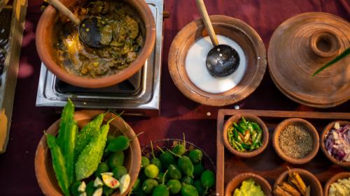 a group of bowls of food on a table at Siddhalepa Ayurveda Resort - All Meals, Ayurveda Treatment and Yoga in Wadduwa