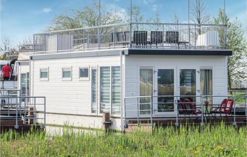 a white house with chairs on top of it at Bluff in Aalsmeer