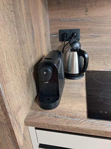 a coffee maker sitting on top of a counter at Apartman terasa v Dole in Cerny Dul