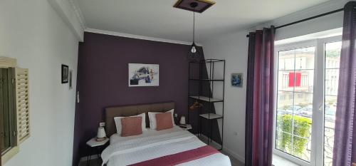 a bedroom with a bed and a window at Funky Guest House & Adventures in Përmet