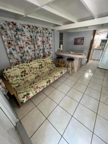 a bedroom with a bed and a table in a room at Boquerón Beach & Country Cabins in Boqueron