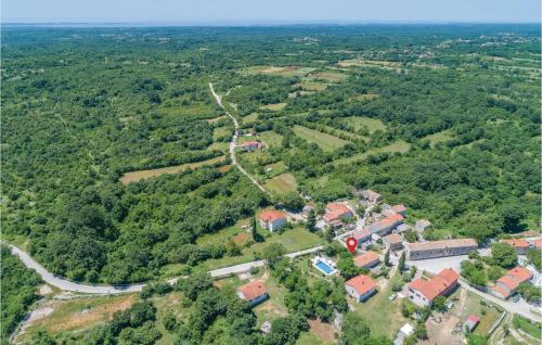 an aerial view of a village in the forest at Holiday Home Butkovici Croatia in Butkovići