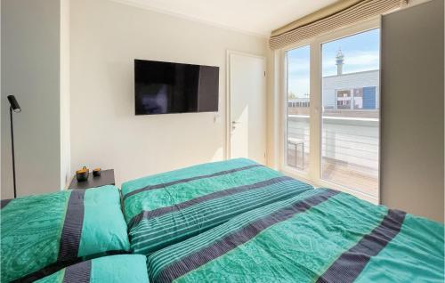 Ένα ή περισσότερα κρεβάτια σε δωμάτιο στο Ferienhaus Jolle