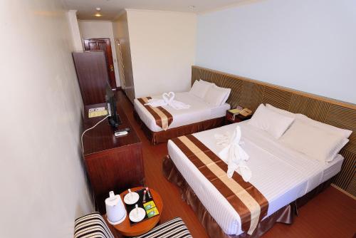 Ένα ή περισσότερα κρεβάτια σε δωμάτιο στο Airai Water Paradise Hotel & Spa