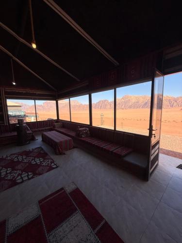 a large room with a view of the desert at Milky Way Wadi Rum in Wadi Rum