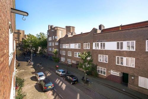 an overhead view of a street with parked cars and buildings at Beautiful quiet Apt in the center of Amsterdam in Amsterdam