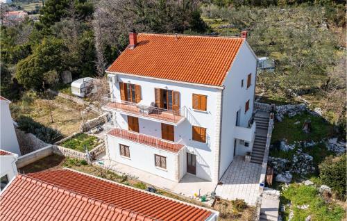 an aerial view of a white house with an orange roof at Lovely Apartment In Slano With Wifi in Slano
