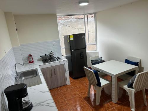 Kuchyň nebo kuchyňský kout v ubytování Apartamento en pasto
