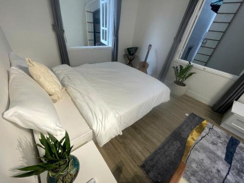 Ein Bett oder Betten in einem Zimmer der Unterkunft CHARM CHARM - kimmy housing - 48 To Ngoc Van