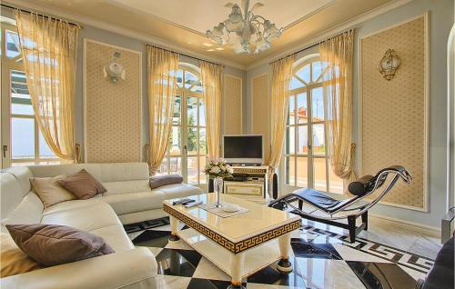 a living room with a couch and a table at Stunning Home In Porec With Wifi in Poreč