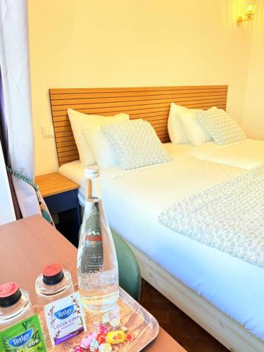 Ένα ή περισσότερα κρεβάτια σε δωμάτιο στο Happy Sintra Inn