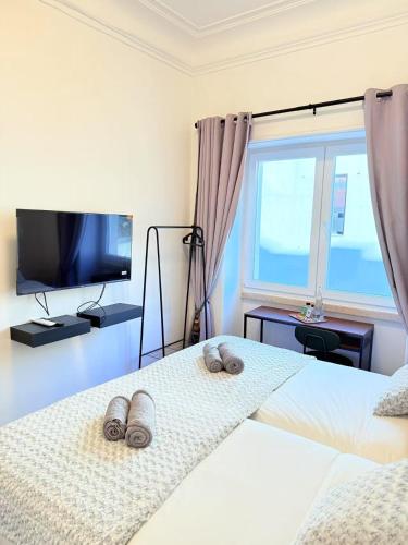 Ένα ή περισσότερα κρεβάτια σε δωμάτιο στο Happy Sintra Inn