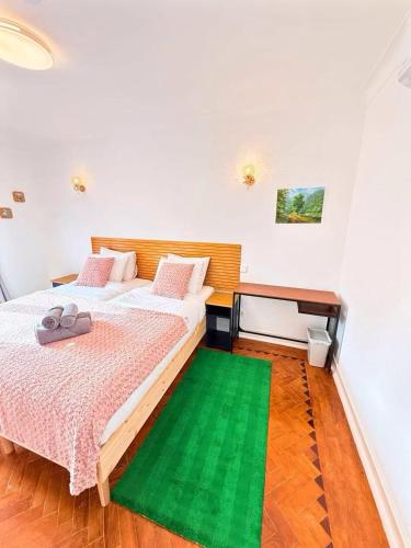 Ένα ή περισσότερα κρεβάτια σε δωμάτιο στο Happy Sintra Inn