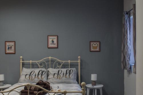 a bedroom with a bed with a pillow on it at Brand New 3 BDR Apartment in a Quaint Village in Fgura
