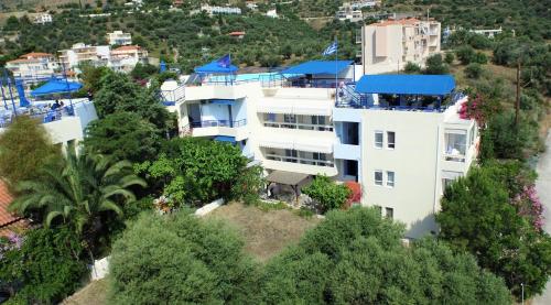 an aerial view of a large white building at Heliotopos Apartments in Tolo