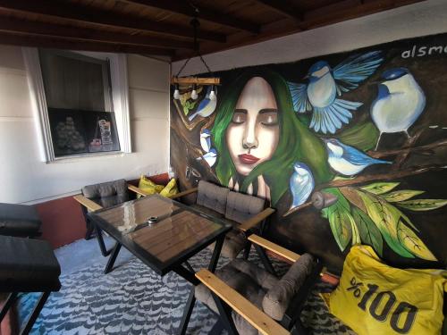 a room with a painting on the wall at LAVİNYA PENSİON in Kusadası