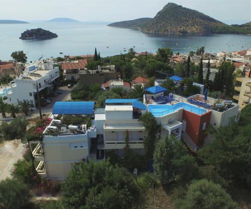 an aerial view of a town with the water at Heliotopos Apartments in Tolo