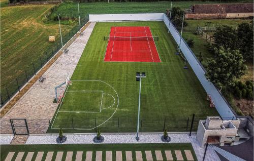an aerial view of a tennis court with a soccer field at Awesome Home In Koritna With Sauna in Koritna
