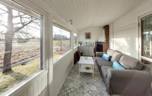 a living room of a tiny house with a couch and a window at Stunning Home In Gashult With Wifi in Gashult