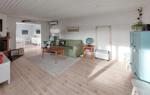 a living room with a couch and a table at Stunning Home In Gashult With Wifi in Gashult