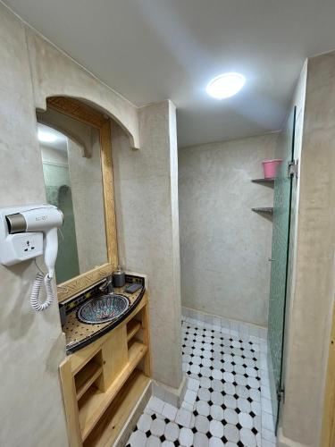 a bathroom with a sink and a shower at Tirazir House 5 in Mirleft