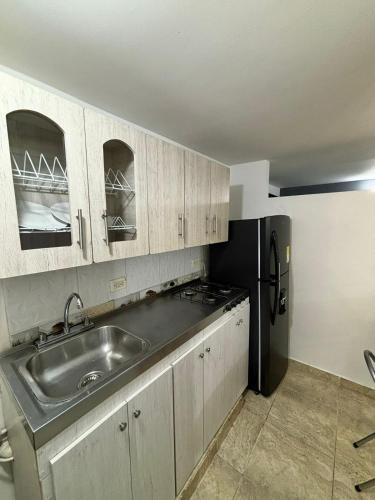 Кухня или мини-кухня в Apartamentos Bello Antioquia
