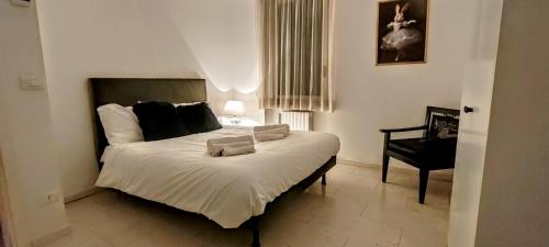 Una cama o camas en una habitación de Dimora Arte e Vino